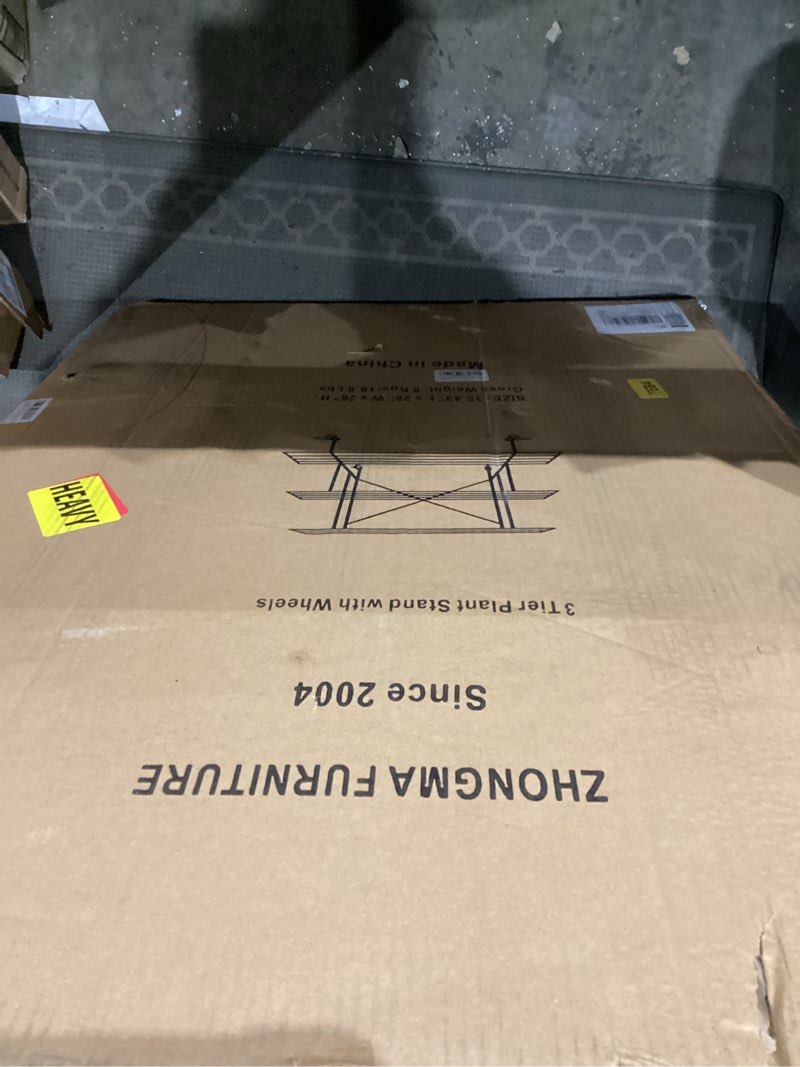 Condition photo showing New/Like New for Zhongma 3 Tier Sturdy Metal Plant Stand with Wheels, L35.43 x W26 x H26 inch, Heavy Duty Plant Holder for Home Indoor and Outdoor, 660 LBS Capacity & Heavy Duty Construction