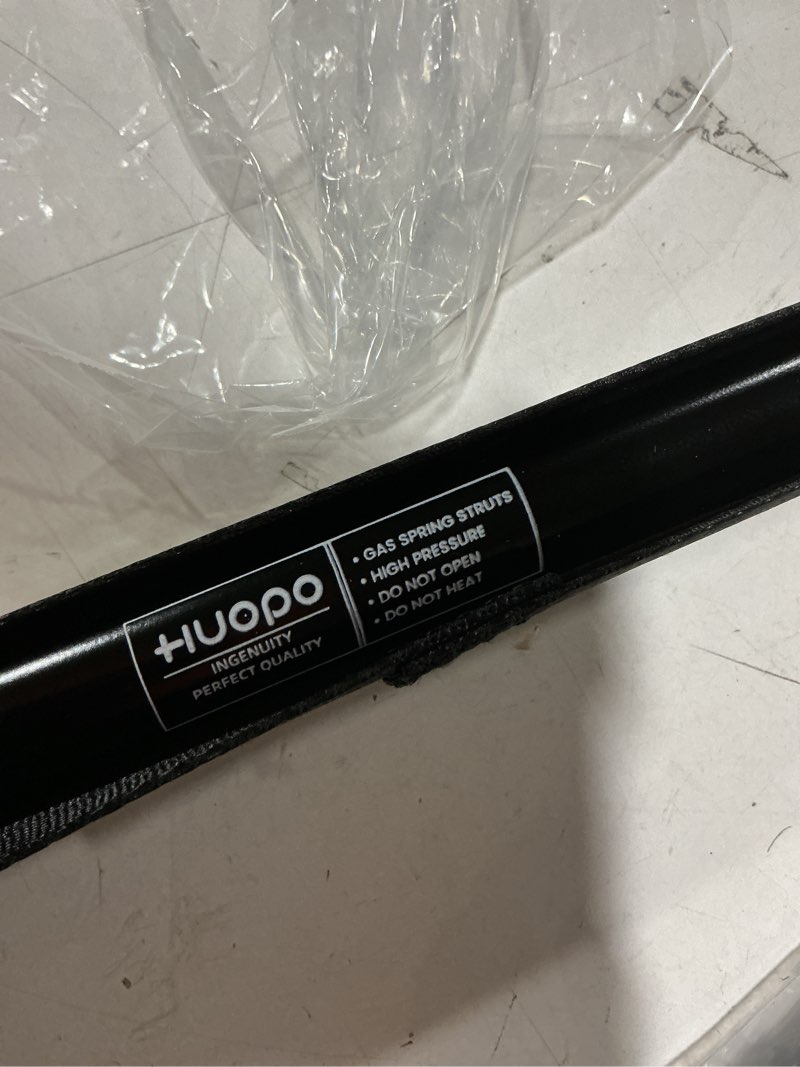 Condition photo showing As Is for huopo gas spring struts