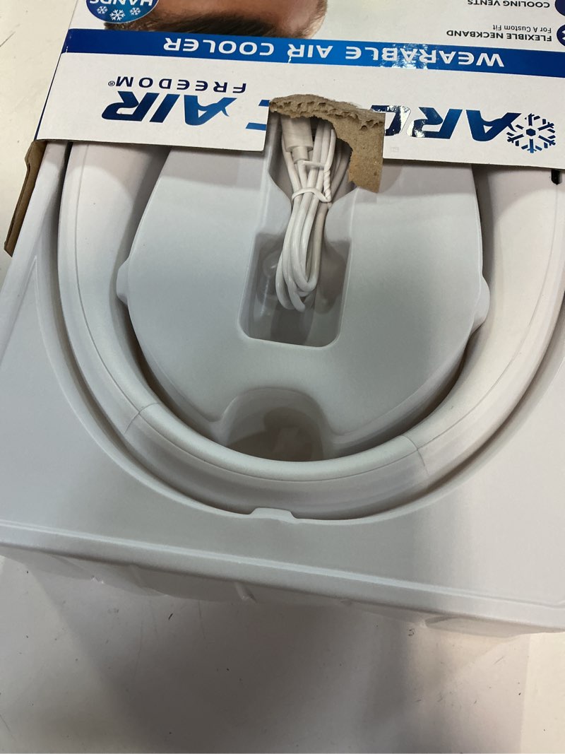 Condition photo showing As Is for arctic air freedom neck cooler, portable neck fan with 3 fan speeds, usb charging, 6-hour battery