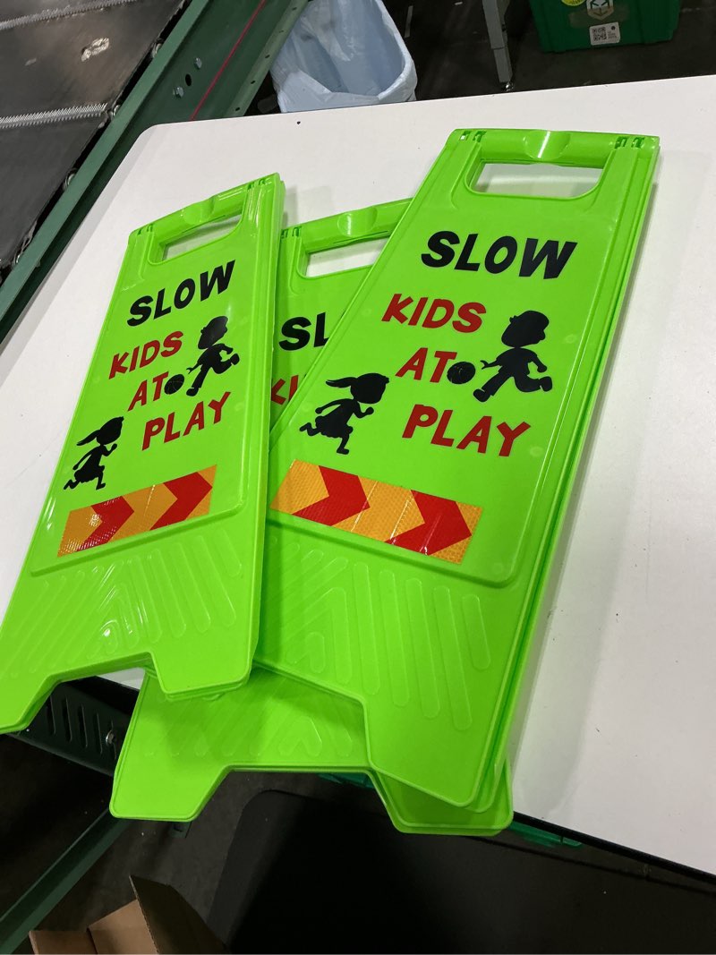 Condition photo showing Good Condition for slow down kids at play sign, kids at play safety signs for street with reflective tape, children at play safety signs 22.4" h double-sided text and graphics easier to identify for neighborhoods community(3 pack green)