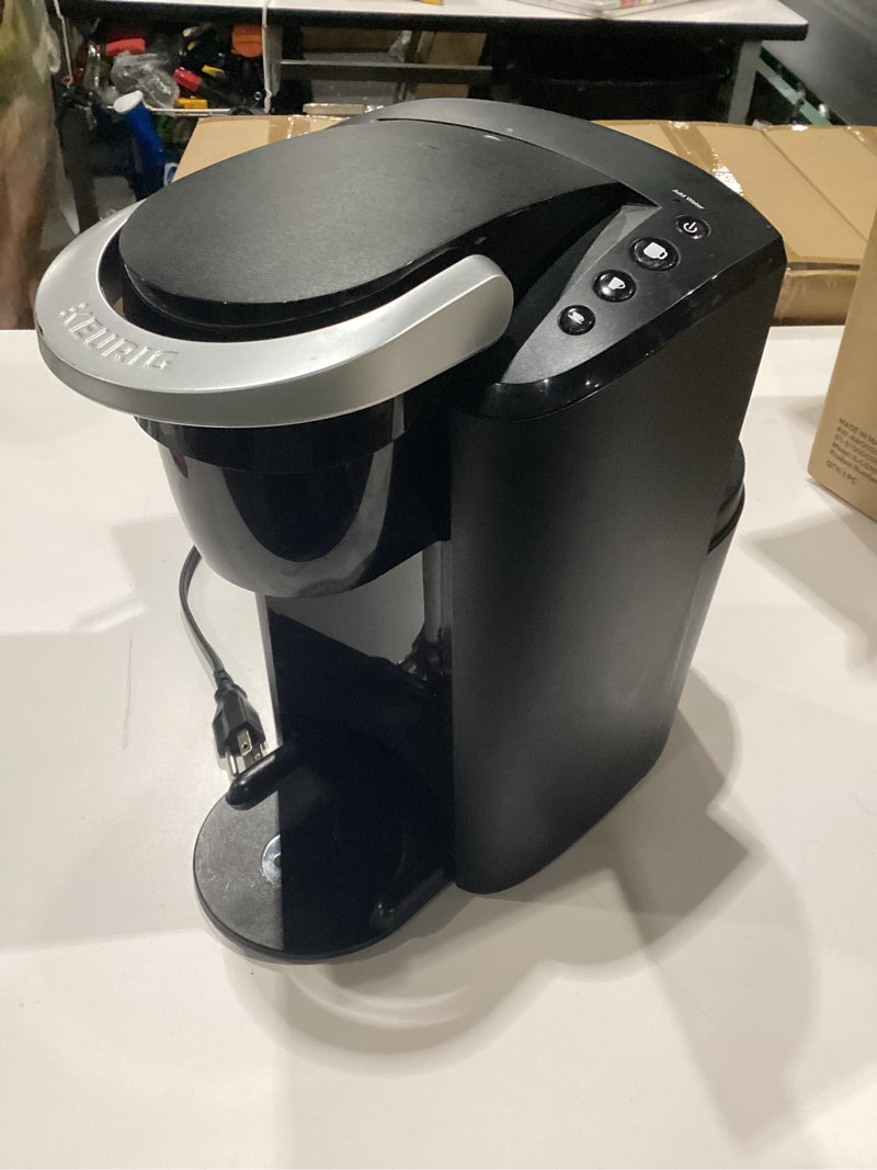 Condition photo showing As Is for incomplete missing accessories and water tank keurig k-compact single-serve k-cup pod coffee maker, with 3 brew sizes, smart start feature, 36oz removable reservoir, black