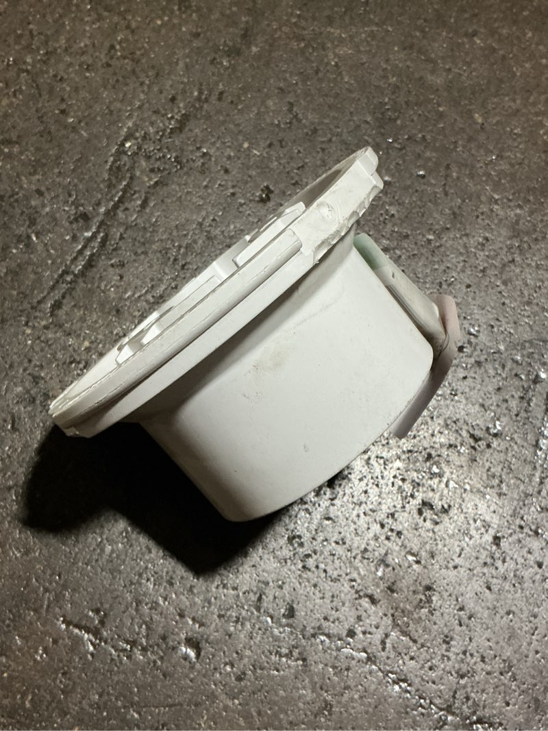 Condition photo showing As Is for fast set 3 in. pvc hub spigot toilet flange with test cap and stainless steel ring