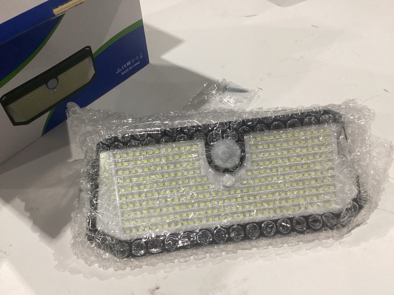 Condition photo showing New/Like New for brightever solar outdoor lights, 4000lm 388 leds motion sensor solar powered outdoor light, ip65 waterproof exterior flood security lights with 270° wide angle & 3 modes for patio garage, 2-pack 6000k daylight white 2-pack