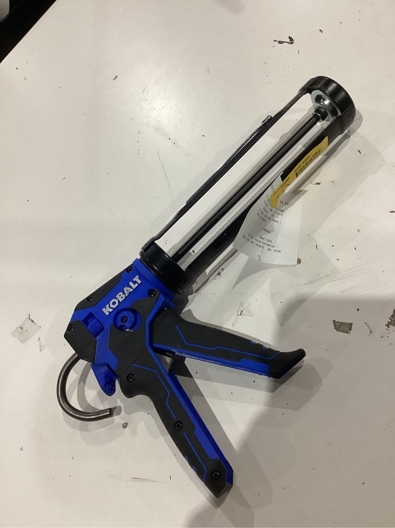 Condition photo showing As Is for kobalt dual thrust 10 -oz anti-drip smooth rod caulk gun