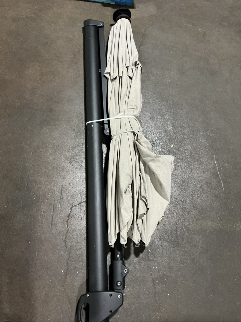 Condition photo showing Good Condition for 11-ft aluminum off-white no-tilt cantilever patio umbrella with lights