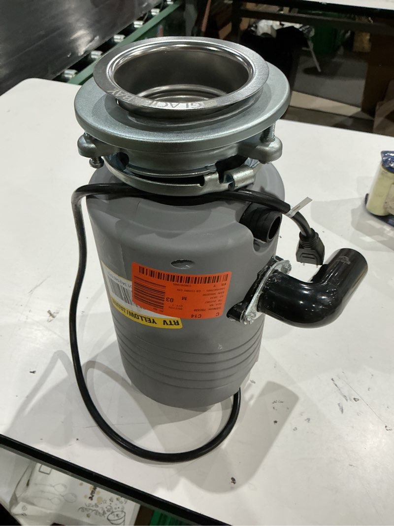 Condition photo showing As Is for turbogrind 1/2 hp. continuous feed garbage disposal with power cord