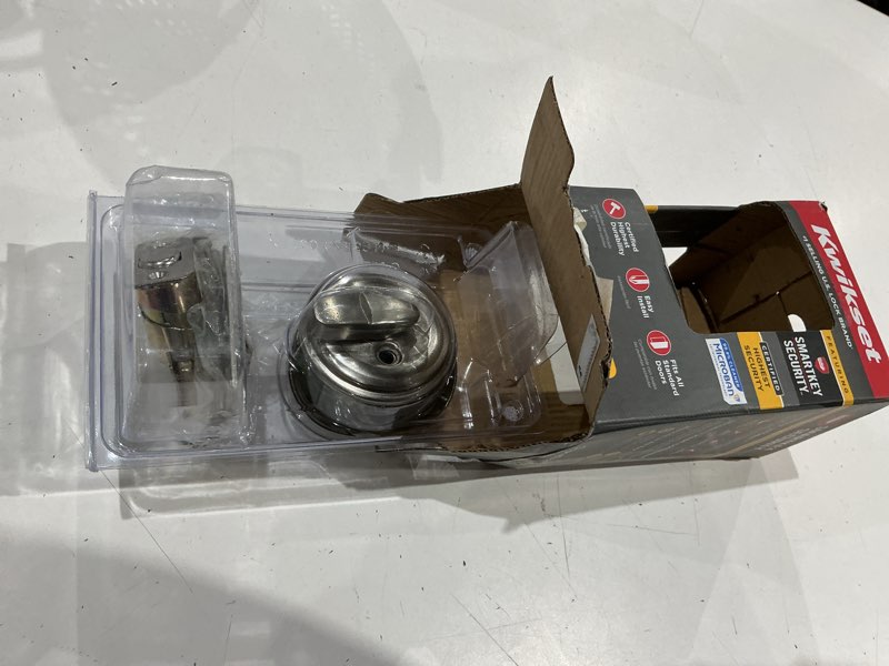 Condition photo showing As Is for kwikset smartkey satin nickel metal deadbolt