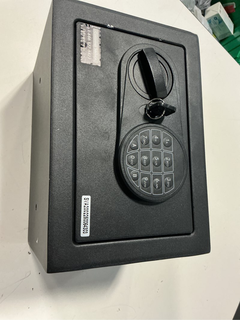 Condition photo showing As Is for pen + gear small digital safe with electronic lock and backup key in black model 17scm