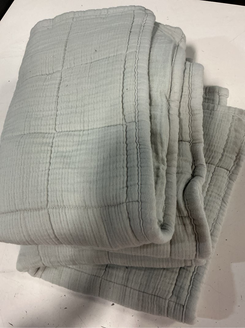 Condition photo showing As Is for organic ribbed  coverlet set 20 in x 20 in 