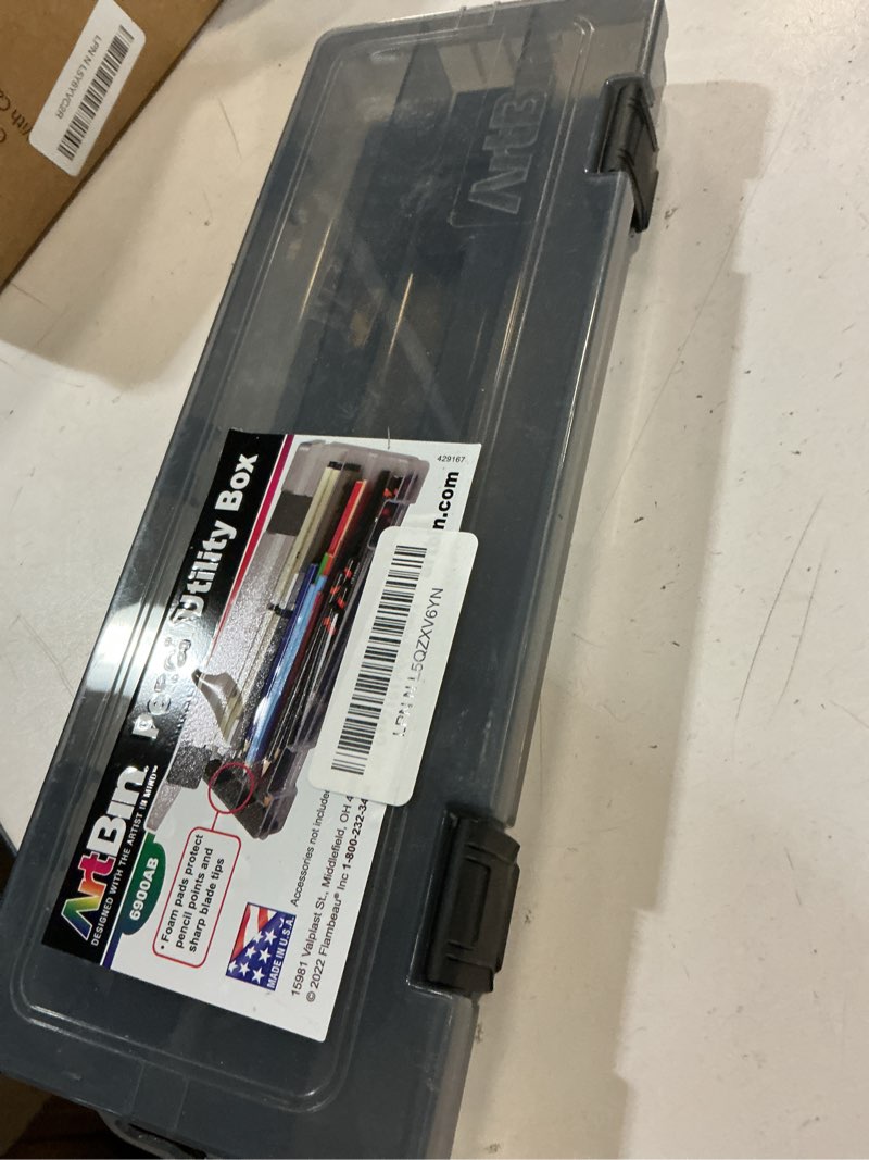 Condition photo showing As Is for ArtBin 6900AB Pencil Utility Box, Art & Craft Organizer, [1] Divided Storage Box for Pens, Pencils, Markers, Paint Brushes, etc., Translucent Charcoal 12.38 by 4.875 by 1.75-Inch