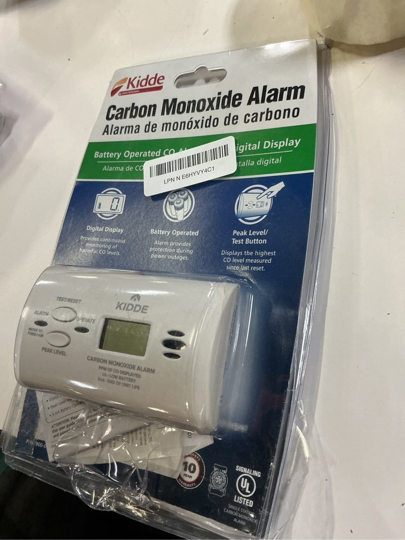 Condition photo showing As Is for kidde carbon monoxide detector, aa battery powered co alarm with leds, test-reset button, low battery indicator, portable