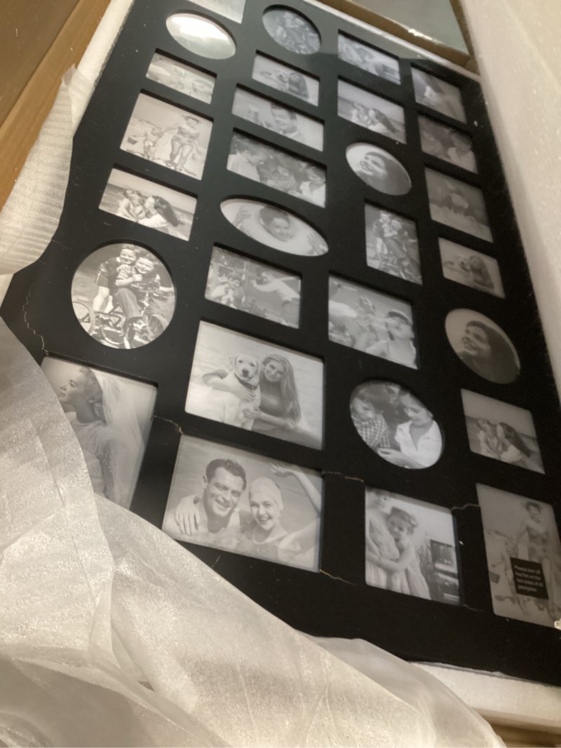 Condition photo showing As Is for Adeco [PF9105] Decorative Black Wood Wall Hanging Collage Picture Photo Frame, 29 Openings, Various Sizes between 3.25x2.75" and 4.5x4"; Square, circular, oval and rectangular openings