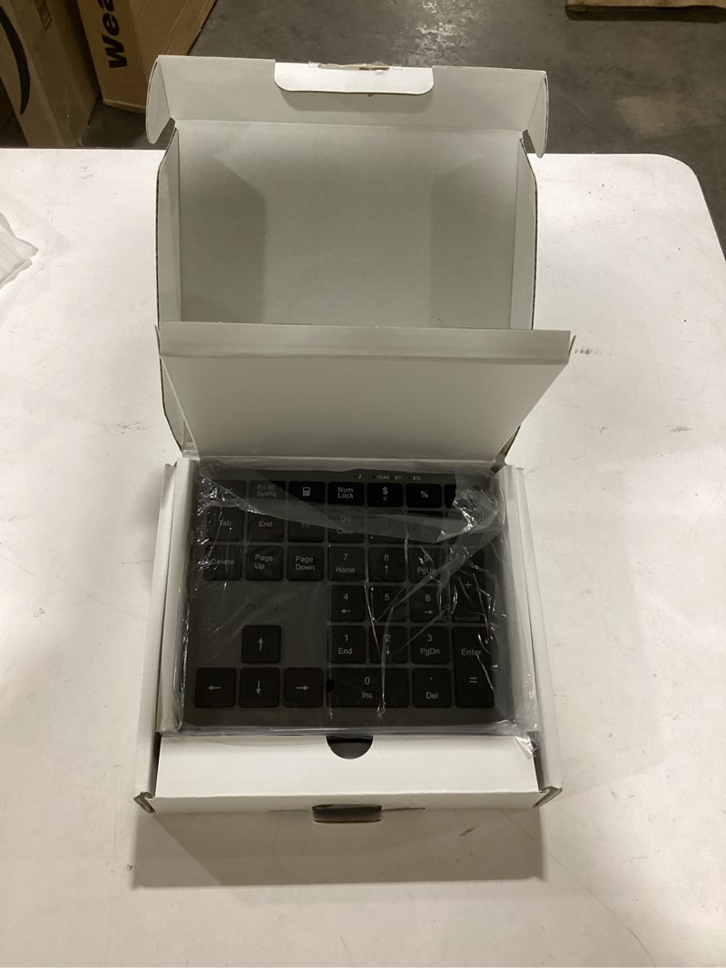 Condition photo showing As Is for Nulea Wireless Number Pad Bluetooth 5.0 & 2.4G Portable Numeric Keyboard, USB-C Rechargeable, 34-Keys Bluetooth Keyboard for Data Entry, Compatible for Laptop, Mac, iMac, Tablet, PC Desktop silver black