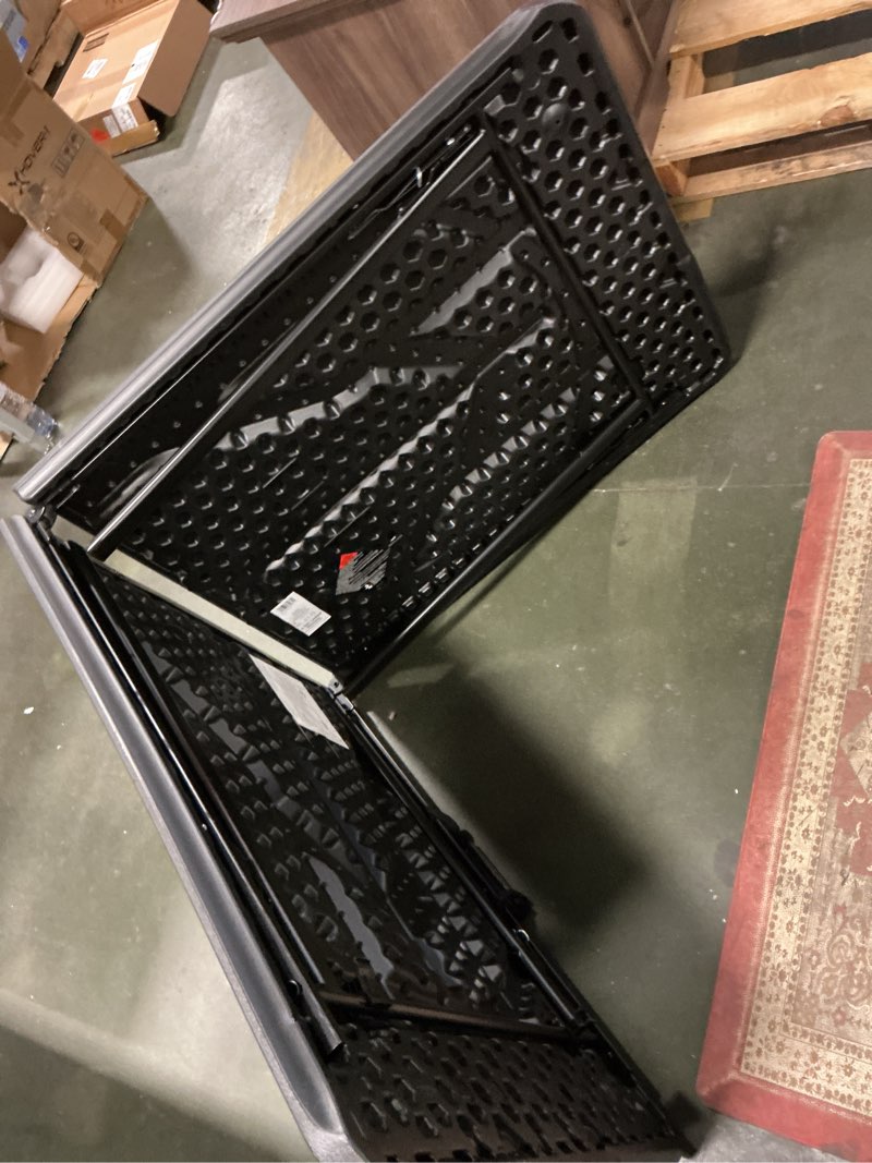 Condition photo showing As Is for Cosco 2.5-ft x 6-ft Fold-in-Half Indoor or outdoor Rectangle Resin Black Folding banquet table 8 -