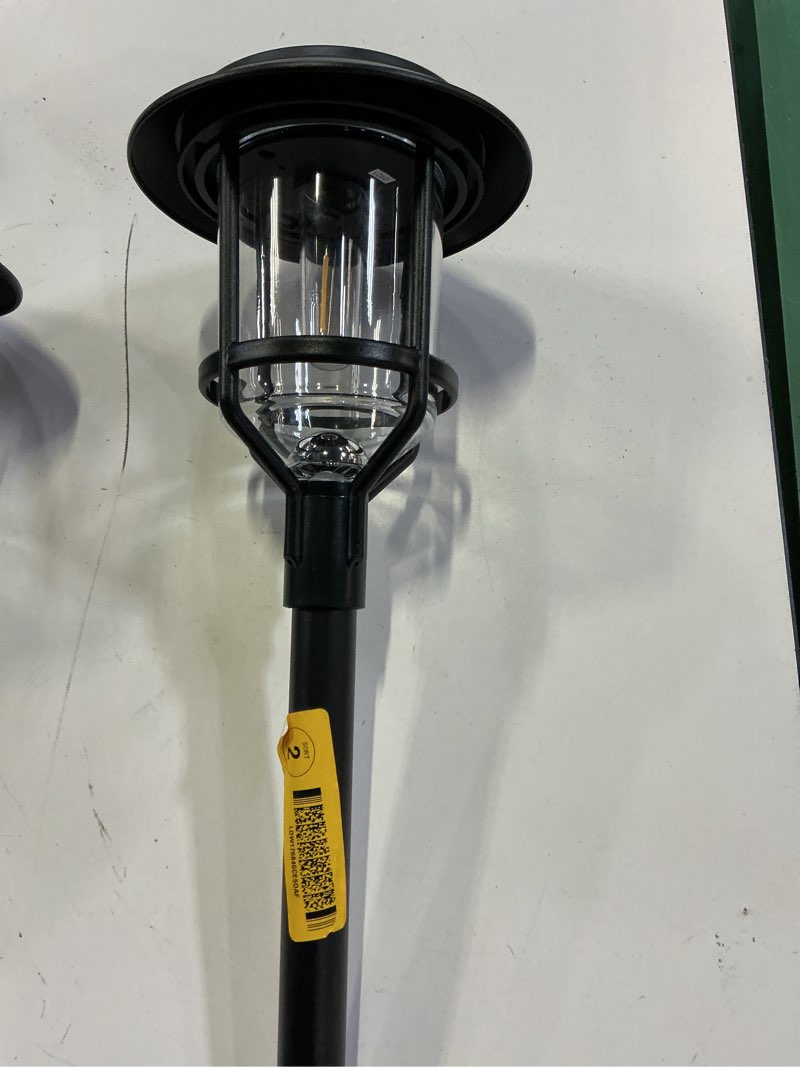 Condition photo showing As Is for harbor breeze 15 -lumens black solar led outdoor path light with dusk-to-dawn sensor 3000-k  2 pack