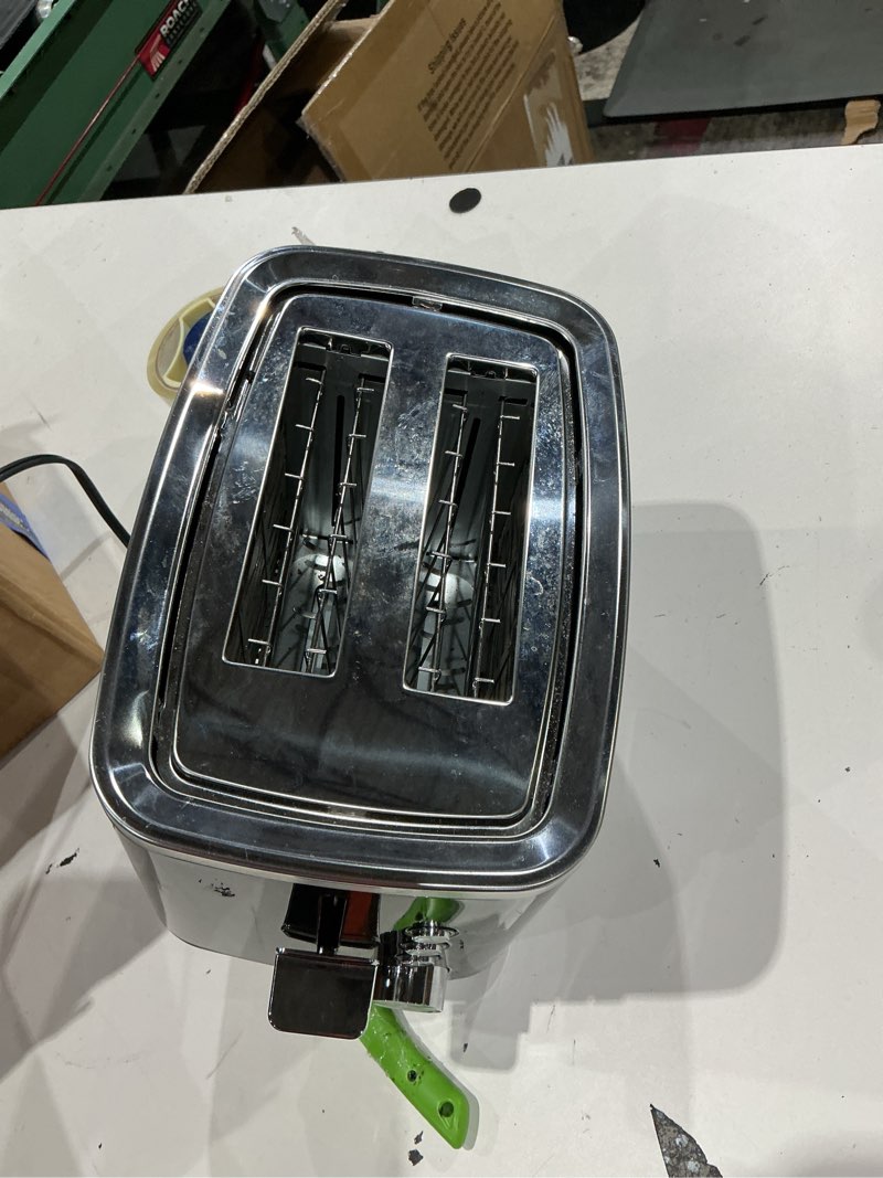 Condition photo showing As Is for ge 2 slice black stainless steel toaster, extra wide slots for toasting bagels, breads, waffles & more, 7 adjustable shade settings, removable crumb tray, countertop kitchen essentials, 850 watts 2-slice black