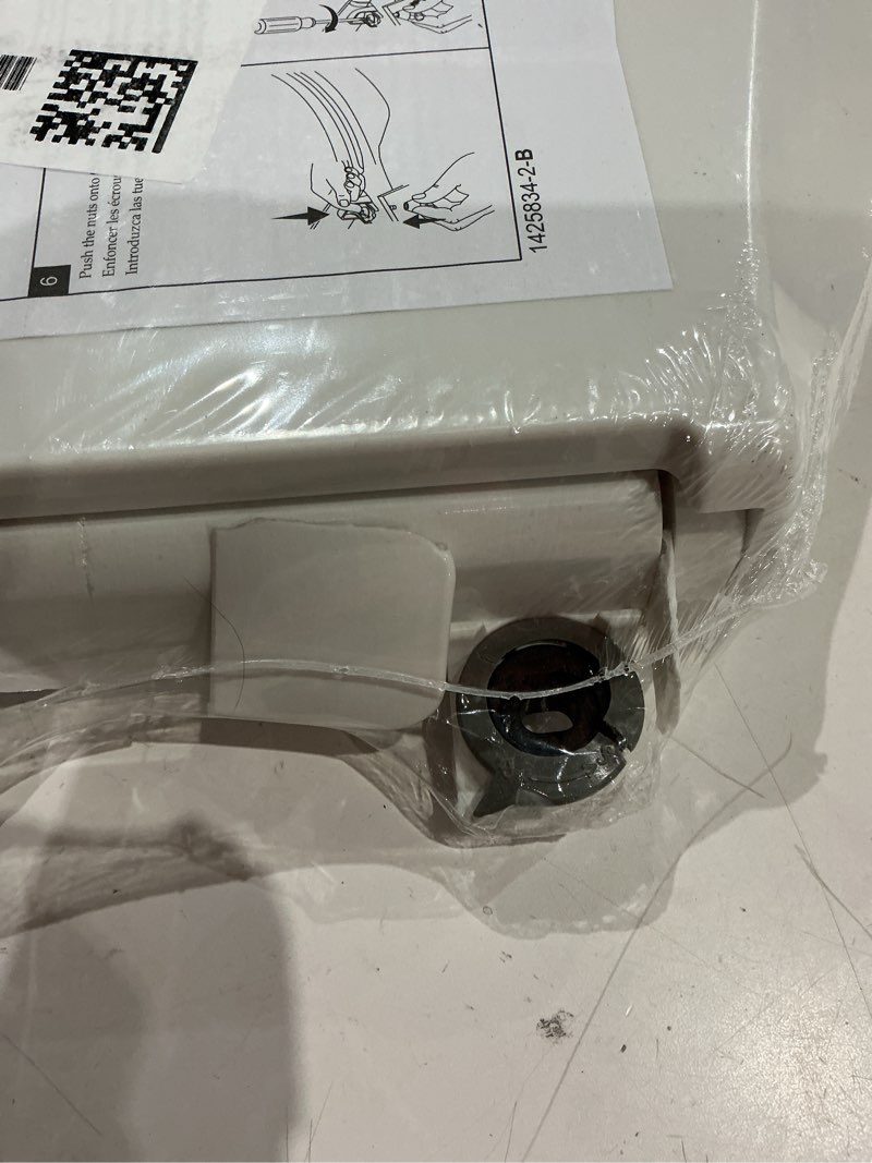 Condition photo showing As Is for (cracked)kohler k-4774-96 brevia elongated toilet seat with quick-release hinges and quick-attach hardware for easy clean, biscuit elongated biscuit