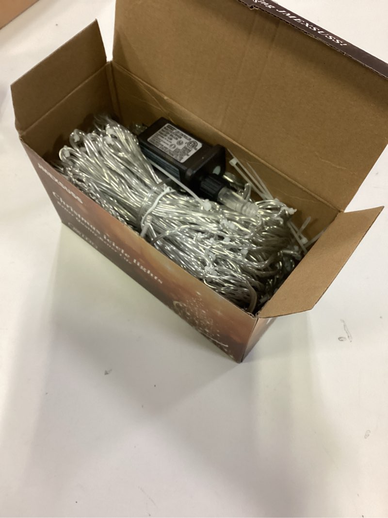 Condition photo showing Good Condition for JMEXSUSS 38.8FT Icicle Lights for Outside, 400 LED Icicle Christmas Lights Outdoor Indoor Plug in, Warm White String Lights for Christmas House Patio Party Fireplace Holiday Decorations Warm White 38.8FT