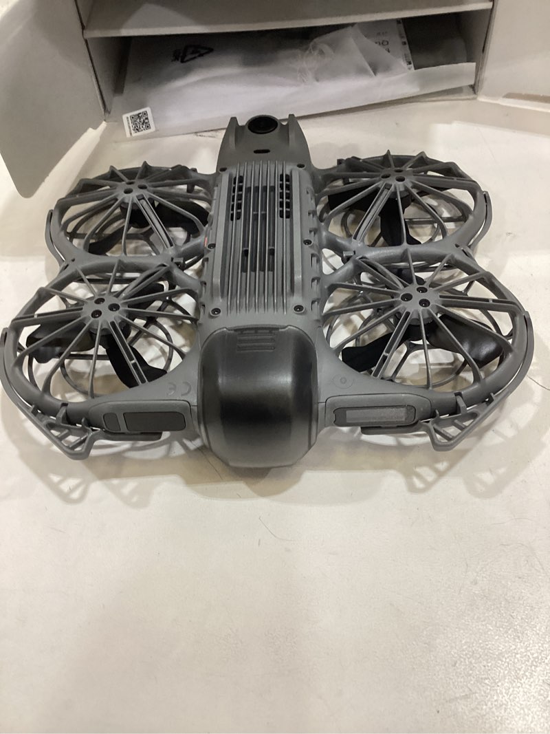 Condition photo showing As Is for dji neo 2 fly more combo (drone only), 4k drone with camera, palm takeoff & landing, gesture control, activetrack, omnidirectional obstacle sensing, 3 batteries