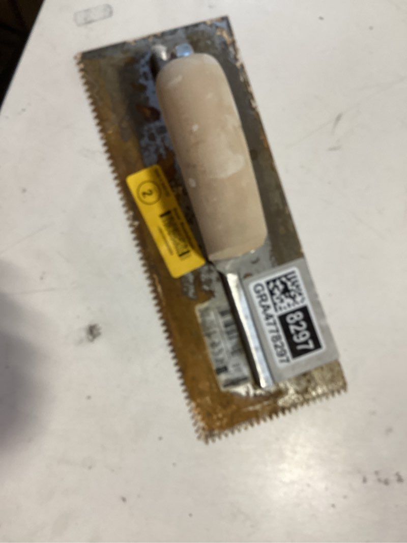 Condition photo showing As Is for marshalltown 11-in ground steel v-notch ceramic floor trowel