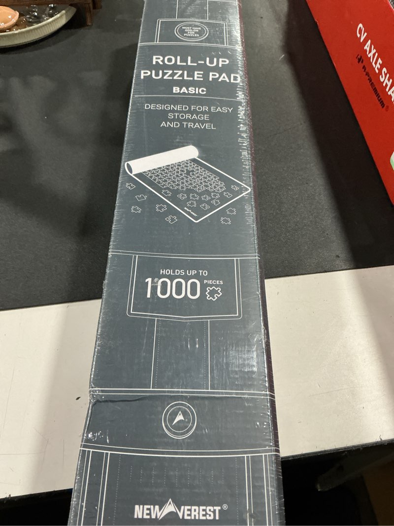 Condition photo showing New/Like New for newverest jigsaw puzzle mat roll up, saver pad 39.4” x 23.6” portable keeper up to 1000 pieces with non-slip rubber bottom and polyester top + 3 puzzle sorting trays, travel-friendly storage bag 1000pcs