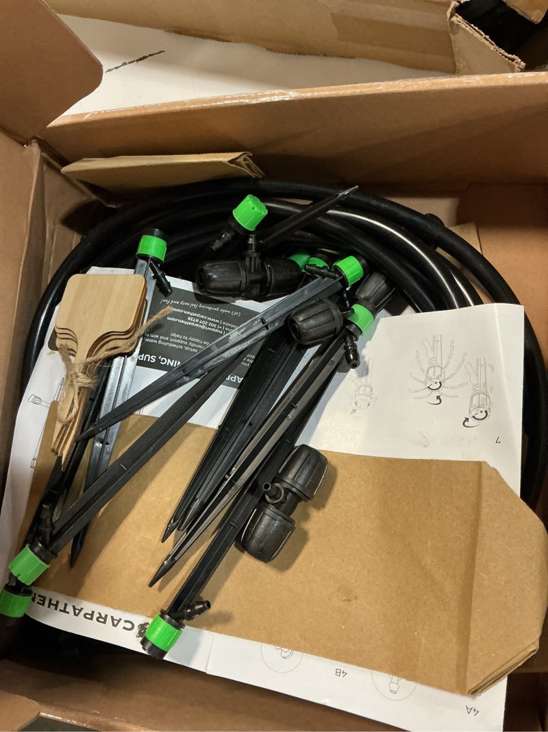 Condition photo showing As Is for carpathen drip irrigation system kit - complete premium garden watering system with adjustable sprinkler emitters, 5/16" & 1/4" tubing and fittings - drip line for raised beds, lawn, pots, greenhouse barbed fitting 100 feet