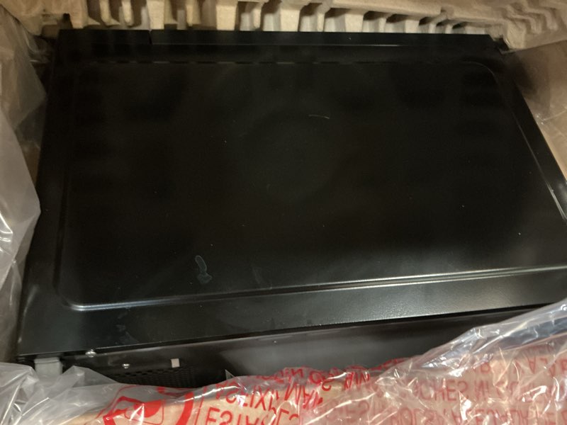 Condition photo showing As Is for mainstays 1.1 cu ft microwave oven in black
