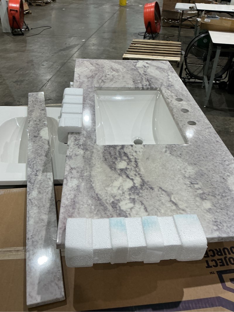 Condition photo showing Good Condition for incomplete  49 in. w x 22 in. d cultured marble vanity top in solid white with solid white basin and 8 in. centerset faucet spread