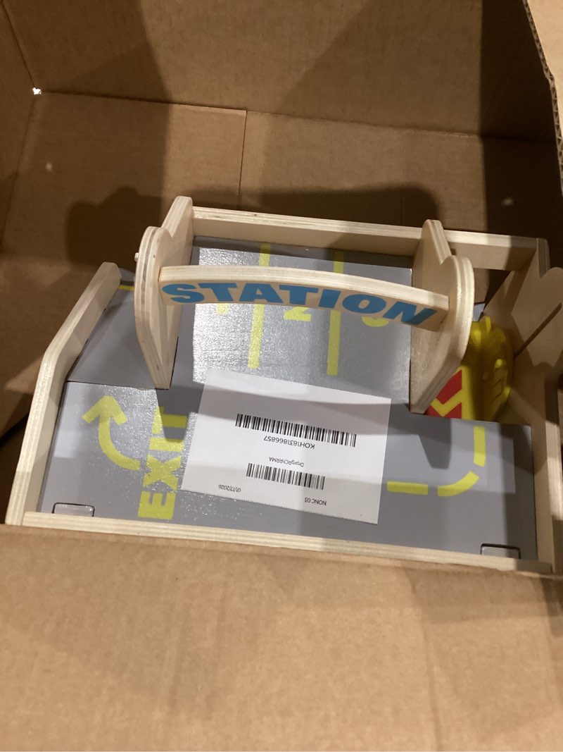 Condition photo showing As Is for Melissa & Doug Service Station Parking Garage with 2 Wooden Cars and Drive-Thru Car Wash