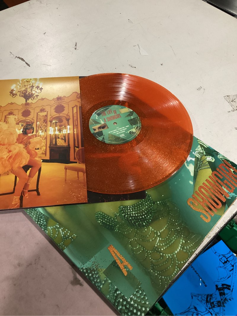 Condition photo showing New/Like New for the life of a showgirl[sweat & vanilla perfume orange glitter vinyl]