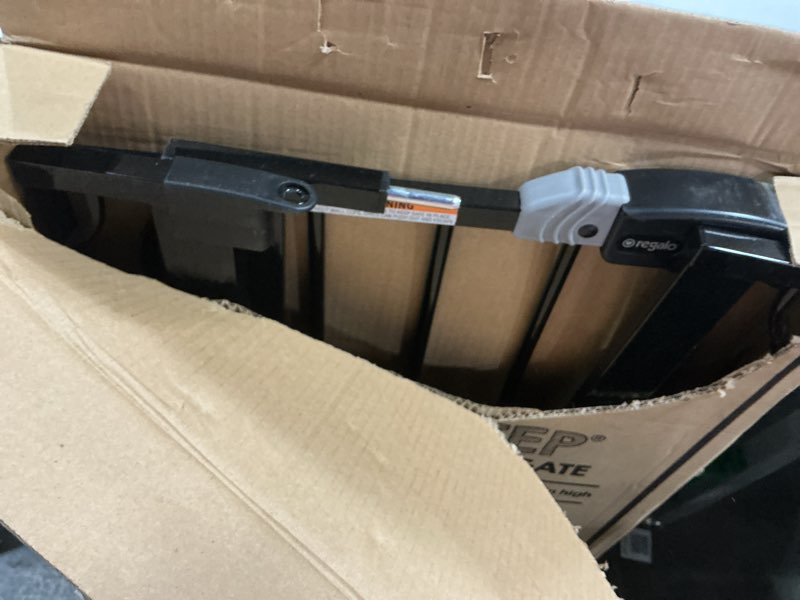 Condition photo showing As Is for Regalo Easy Step Extra Tall Walk Thru Baby Gate, Bonus Kit, Includes 4-Inch Extension Kit, 4 Pack of Pressure Mount Kit and 4 Pack of Wall Cups and Mounting Kit, Black Black 29-36.5\"W x 36\"H