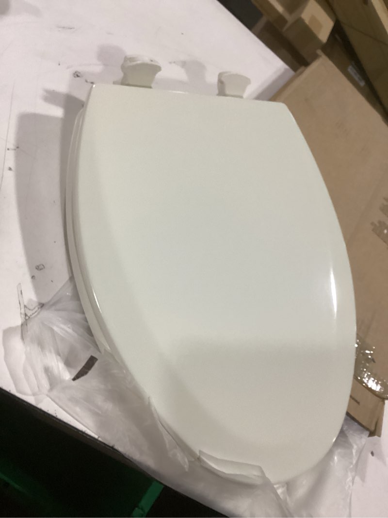 Condition photo showing Good Condition for Bemis Elongated Enameled Wood Toilet Seat in Biscuit with Easy•Clean? Hinge