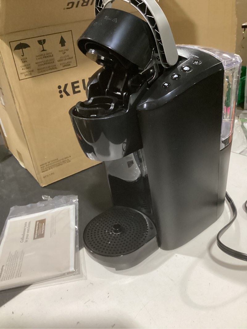 Condition photo showing As Is for keurig k-compact single-serve k-cup pod coffee maker, with 3 brew sizes, smart start feature, 36oz removable reservoir, black