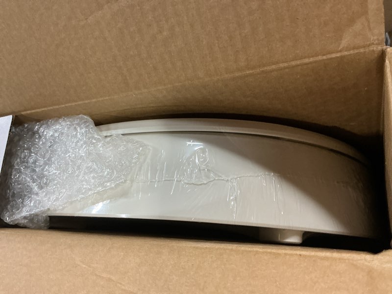 Condition photo showing New/Like New for kohler 25876-96 hyten 3" height, elevated soft close round toilet seat, contoured seat with grip-tight bumpers, quick-attach hardware, biscuit biscuit round