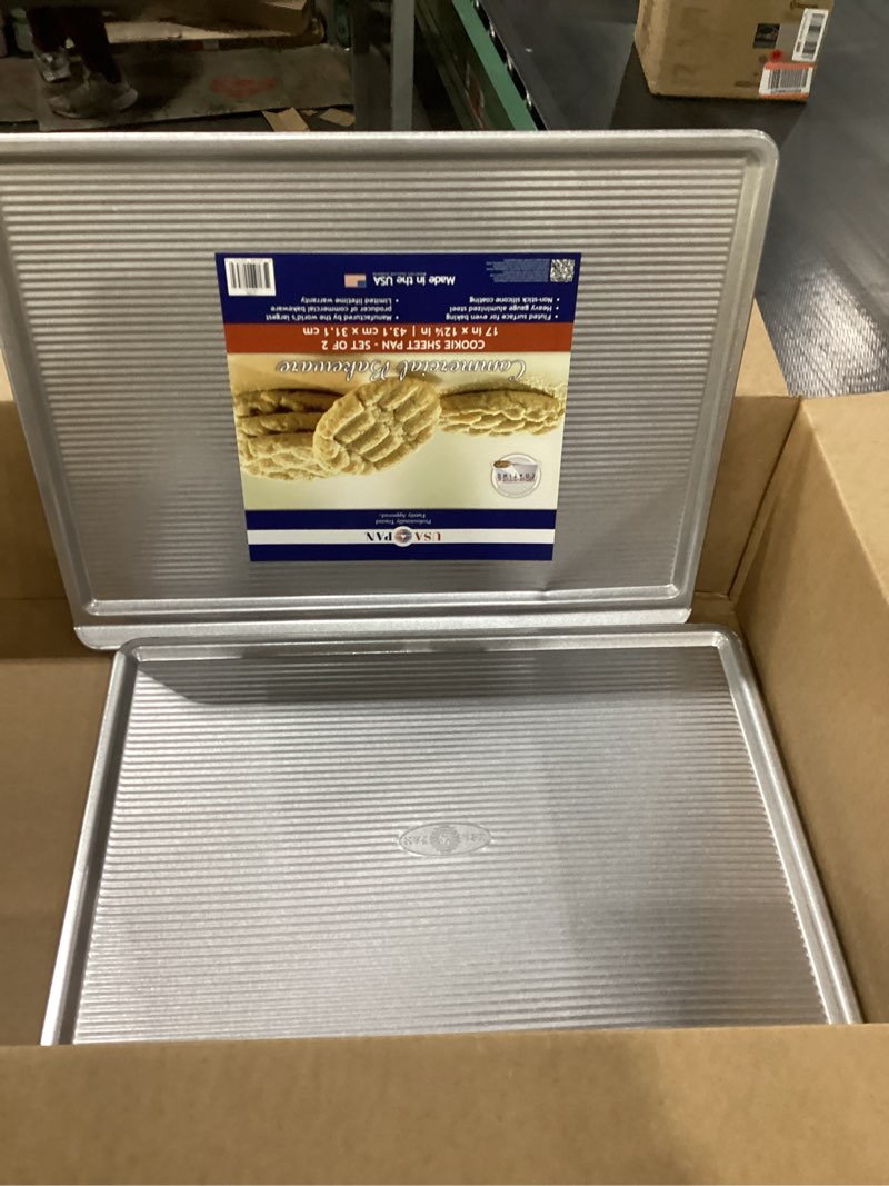 Condition photo showing New/Like New for USA Pan Bakeware Cookie Sheet, Warp Resistant Nonstick Baking Pan, Made in the USA from Aluminized Steel, Large Set of 2 Large - Set of 2