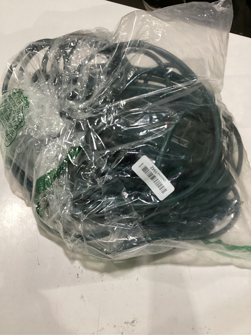 Condition photo showing As Is for outdoor power stake, green, 6 outlets