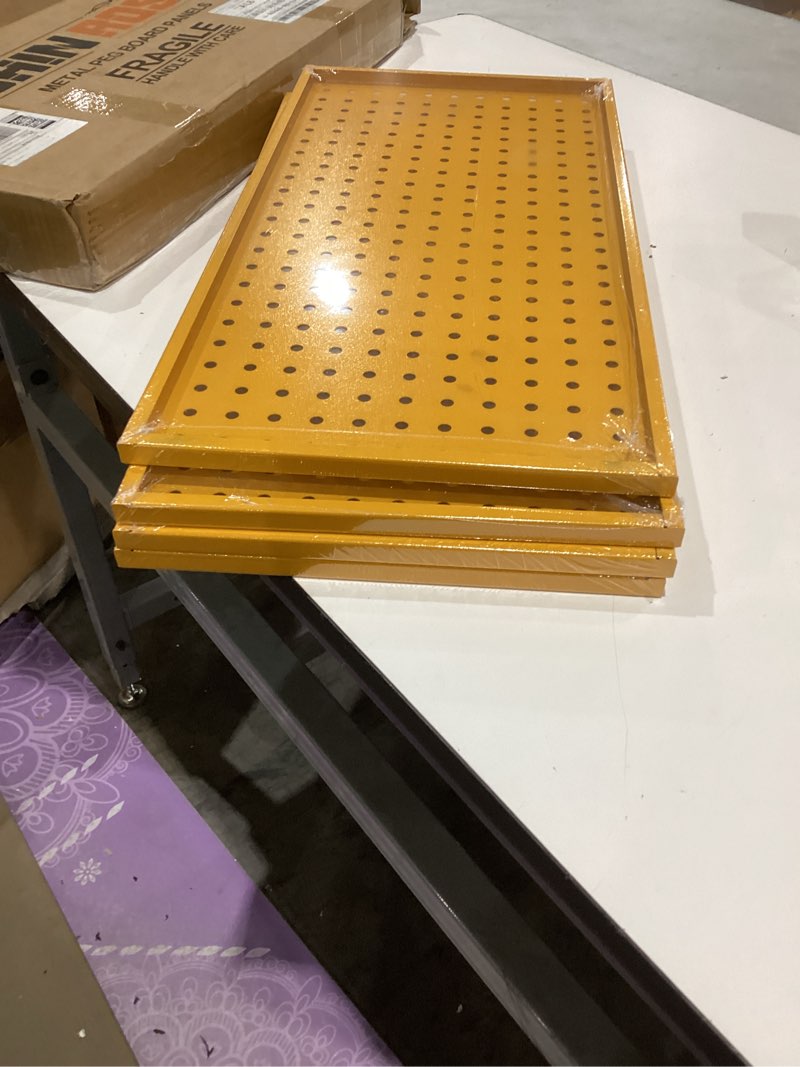 Condition photo showing Good Condition for 4 similar 32in x 16in yellow metal pegboard tool board panel