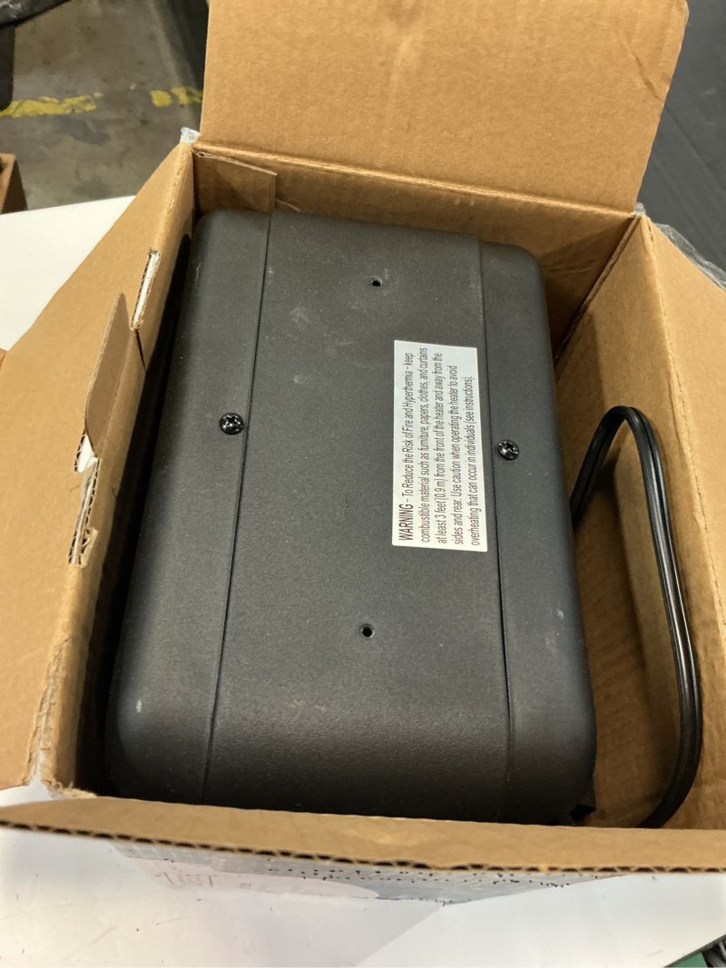 Condition photo showing As Is for utilitech ceramic space heater up to 1500w, 200 sq. ft