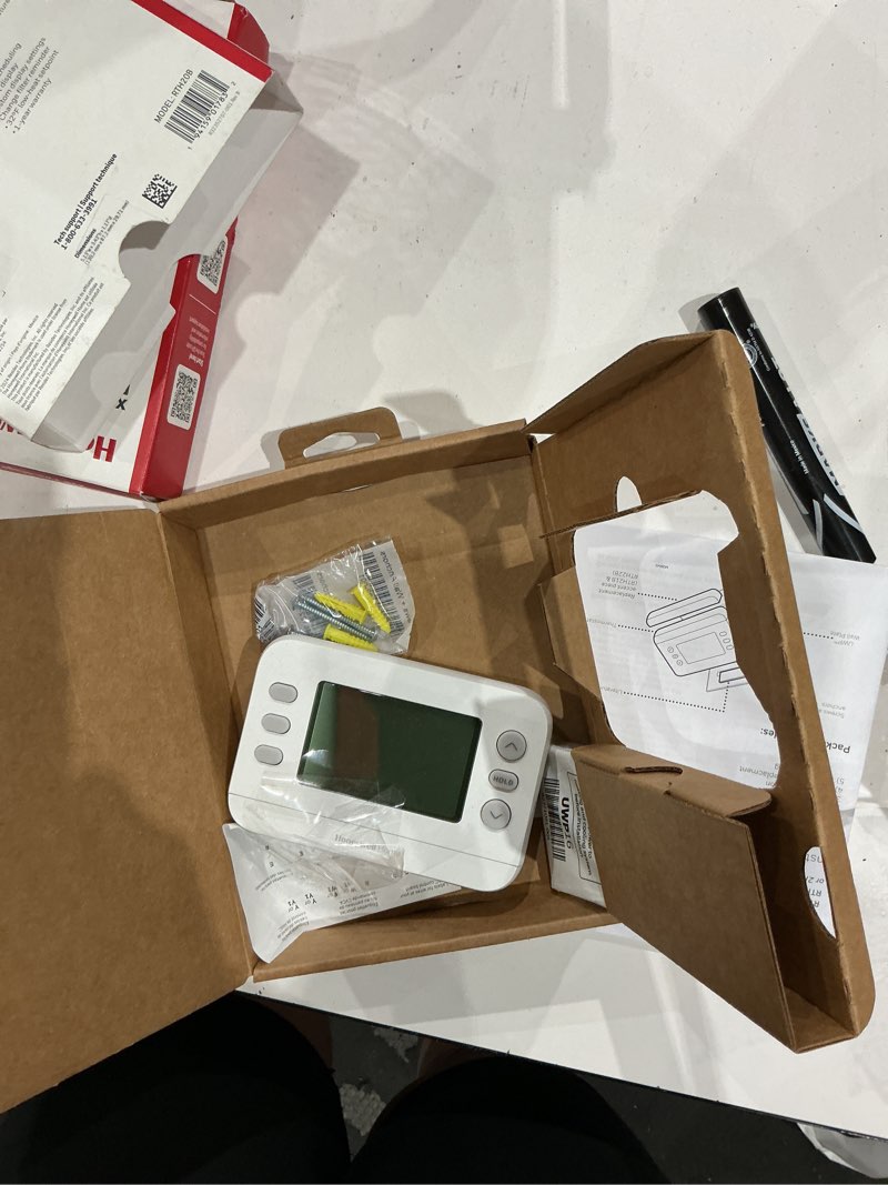 Condition photo showing As Is for honeywell home x2p heating and cooling push button programmable thermostat