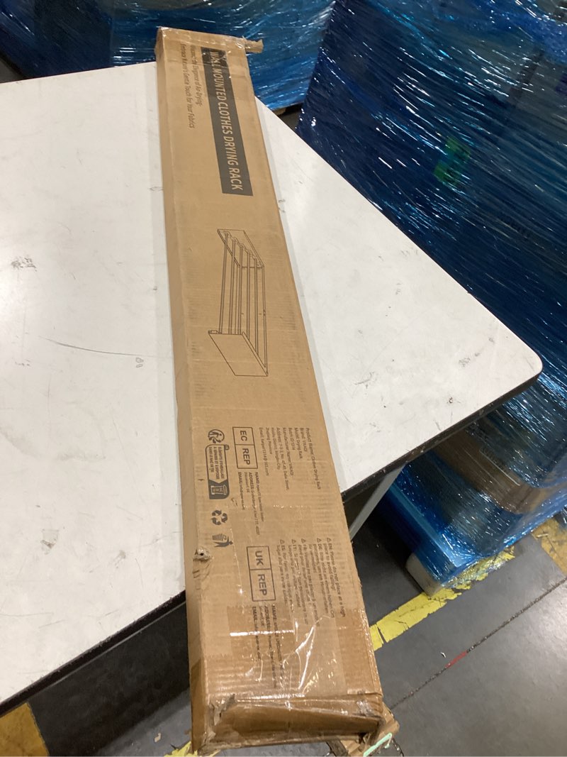 Condition photo showing Good Condition for this package contains a wall mounted clothes drying rack with a slim, collapsible design.