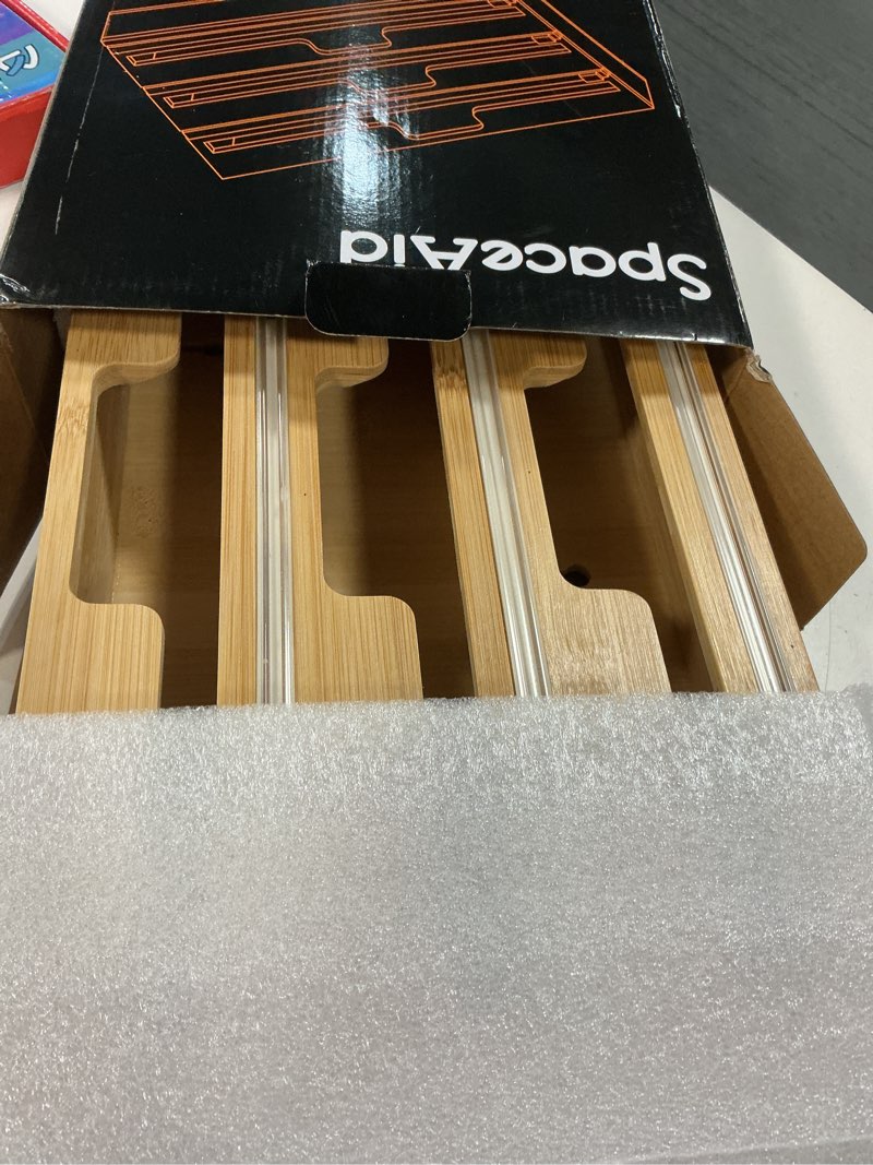 Condition photo showing Good Condition for SpaceAid WrapNeat 3 in 1 Wrap Organizer with Cutter and Labels, Plastic Wrap, Aluminum Foil and Wax Bamboo Dispenser for Kitchen Storage Organization Holder for 12" Roll (Natural) 3-Slot, 3"Tall 01 Natural