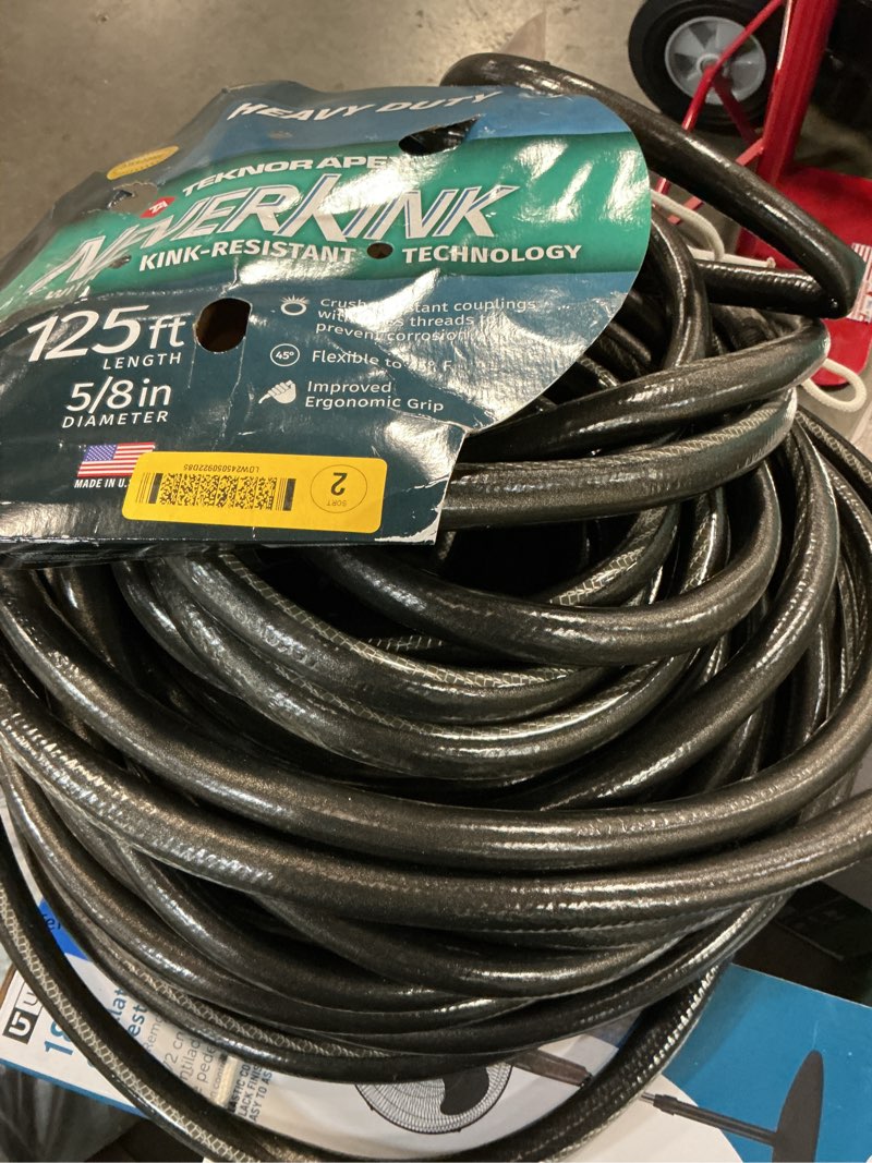 Condition photo showing As Is for neverkink teknor apex 5/8-in x 125-ft heavy-duty kink free vinyl green coiled hose
