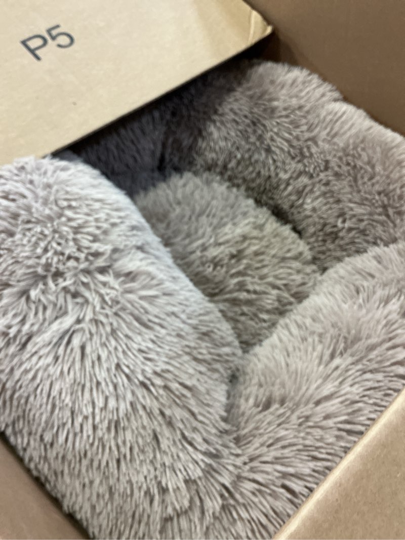 Condition photo showing As Is for petjett calming medium dog bed - 30'' round dog beds, anti-slip & washable super soft fluffy plush donut bed, anti-anxiety premium comfort pet bed, fits dogs up to 45 lbs - beige beige medium - 30”l x 30”w x 8”th