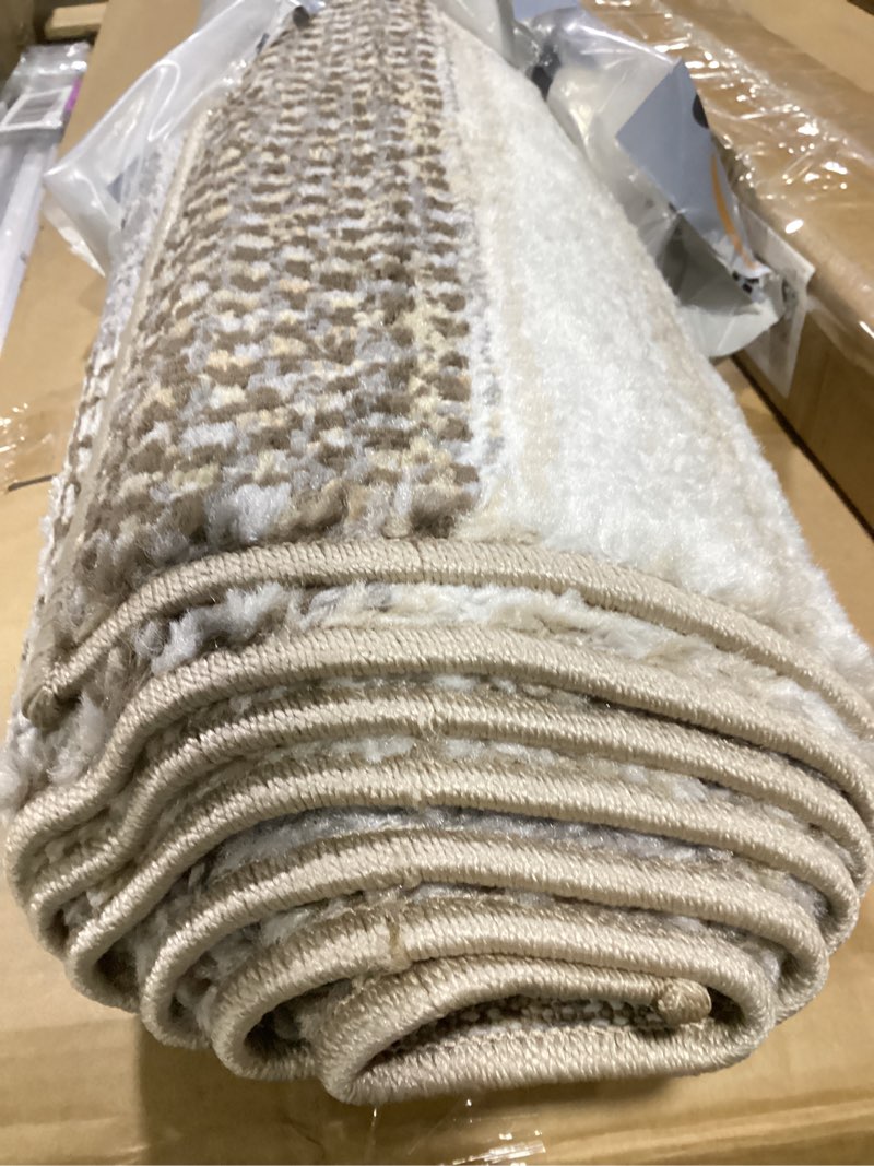 Condition photo showing New/Like New for signature design by ashley sethburn minimalist indoor striped medium 5 x 7 rug, dark brown & gray 4'11" x 6'11" (rectangular)