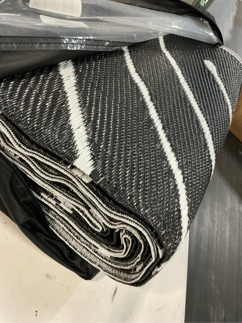 Condition photo showing Good Condition for garvee 9x12 striped extra large outdoor waterproof rug, reversible modern patio carpet for rv, deck, backyard, porch, balcony, beach, garden, outdoor camping mat, black&white. blackwhite 9' x 12' (rectangular)