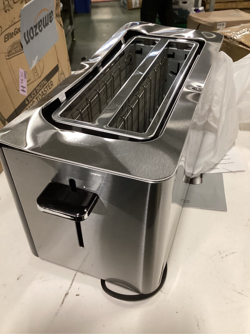 Condition photo showing As Is for ( with dent ) Elite Gourmet ECT5322 Long Slot 4 Slice Toaster, Countdown Timer, Bagel Function 6 Toast Setting, Defrost, Cancel Function, Built-in Warming Rack, Extra Wide Slots for Bagels Waffles, Stainless Steel 4 Slice Black & Stainless Steel