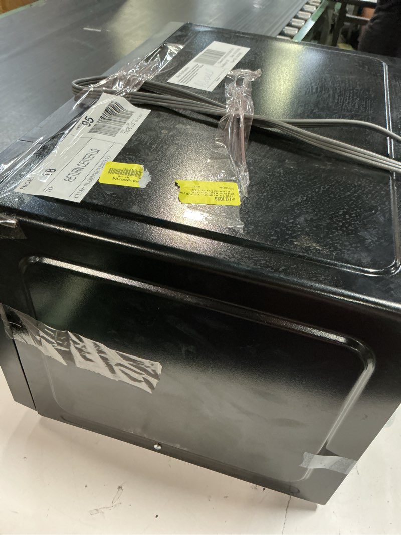 Condition photo showing As Is for mainstays 1.1 cu ft microwave oven in black