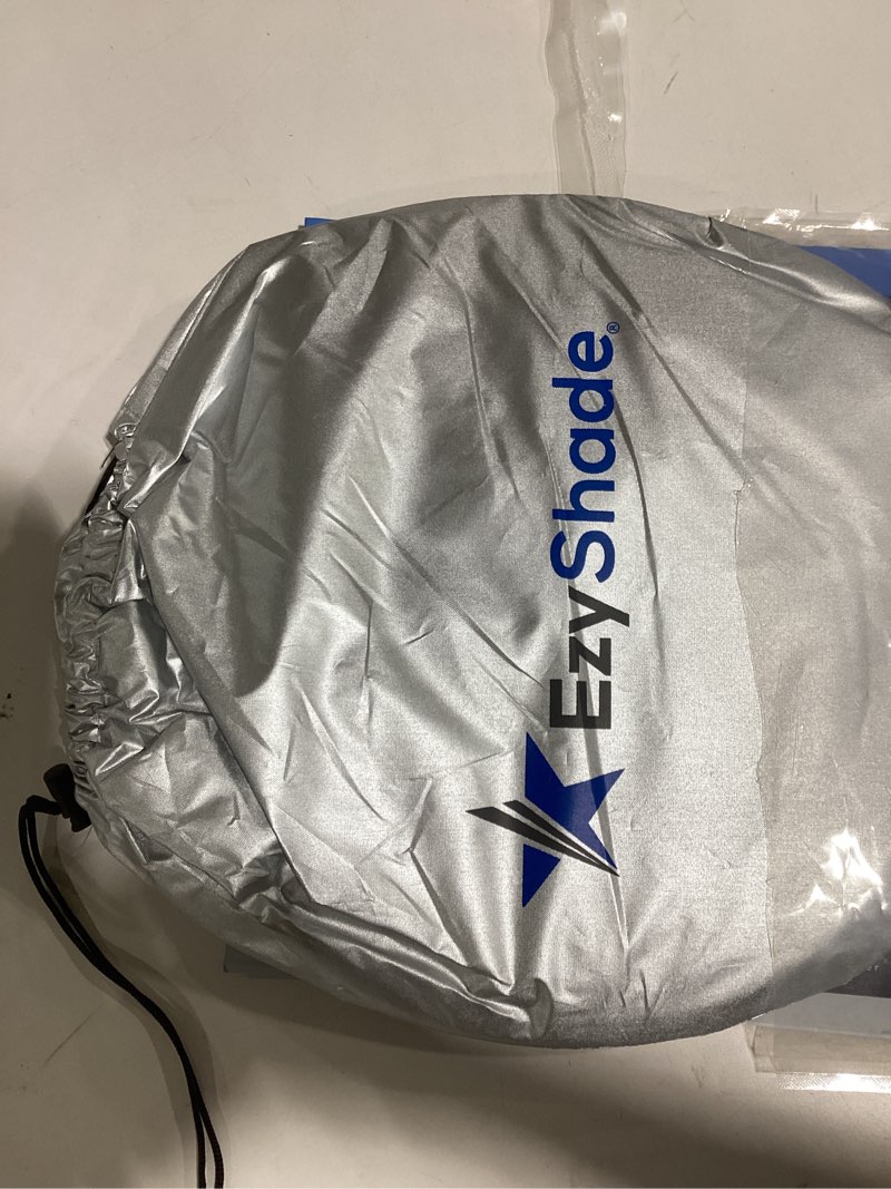 Condition photo showing Good Condition for ezyshade windshield sun shade with shield-x reflective technology. see size-chart with your vehicle. foldable 2-piece car sunshades reflect uv sun and heat and protect your car. standard (medium) size standard (medium) 2-piece foldable sun shade