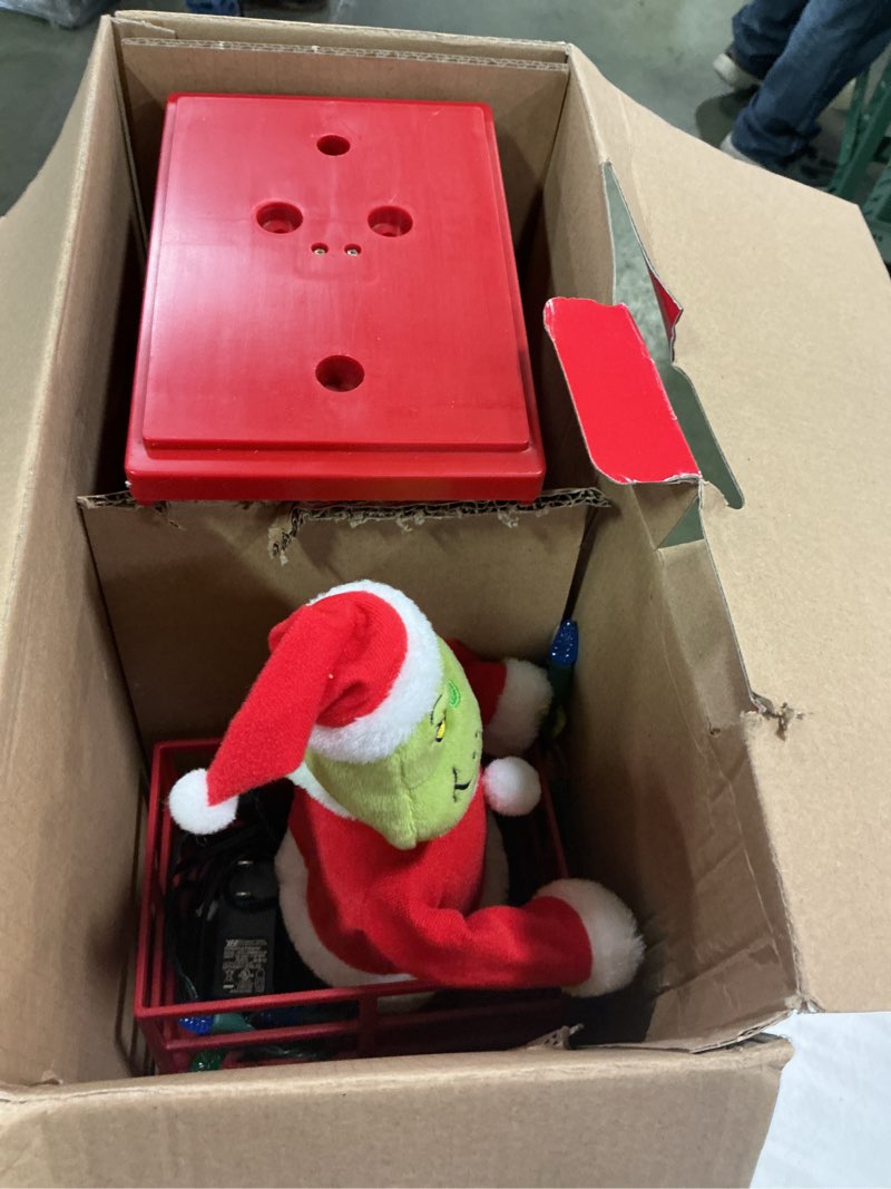 Condition photo showing As Is for The grinch  , grinch’s animated scissor lift 50 in 