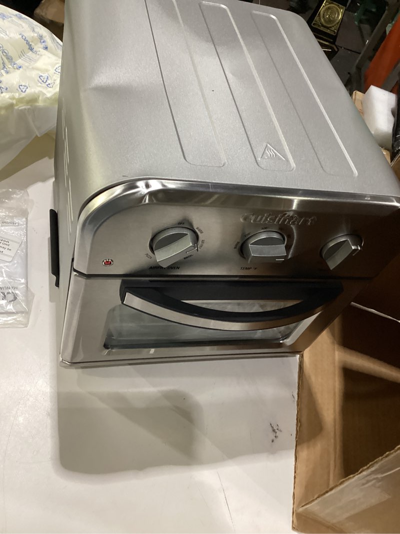 Condition photo showing As Is for cuisinart compact air fryer toaster oven, stainless steel fryer with 6-in-1 functions, adjustable temperature, includes oven rack, baking pan and air fry basket, toa-26 compact air fryer oven stainless steel, not tested, incomplete